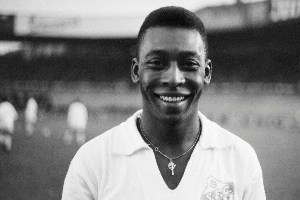 Brazilian striker Pelé, wearing his Santos jersey, smiles before playing a friendly soccer match with his club against the French club of "Racing", on June 13, 1961 at the Parc des Princes, in Paris.