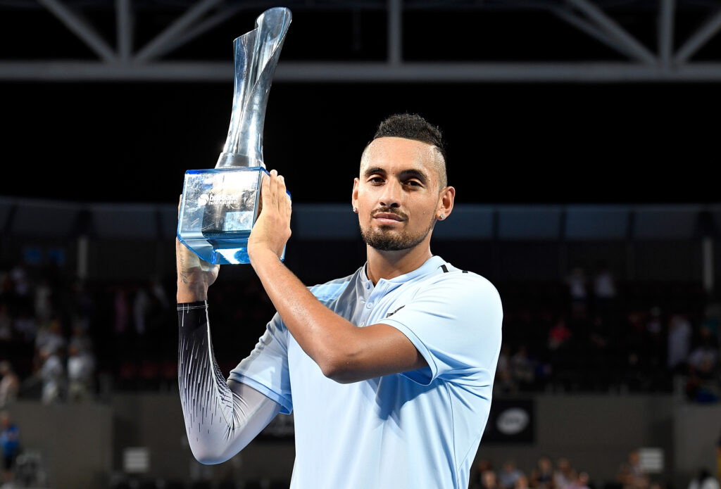 Nick Kyrgios celebrates after winning the 2018 Brisbane International