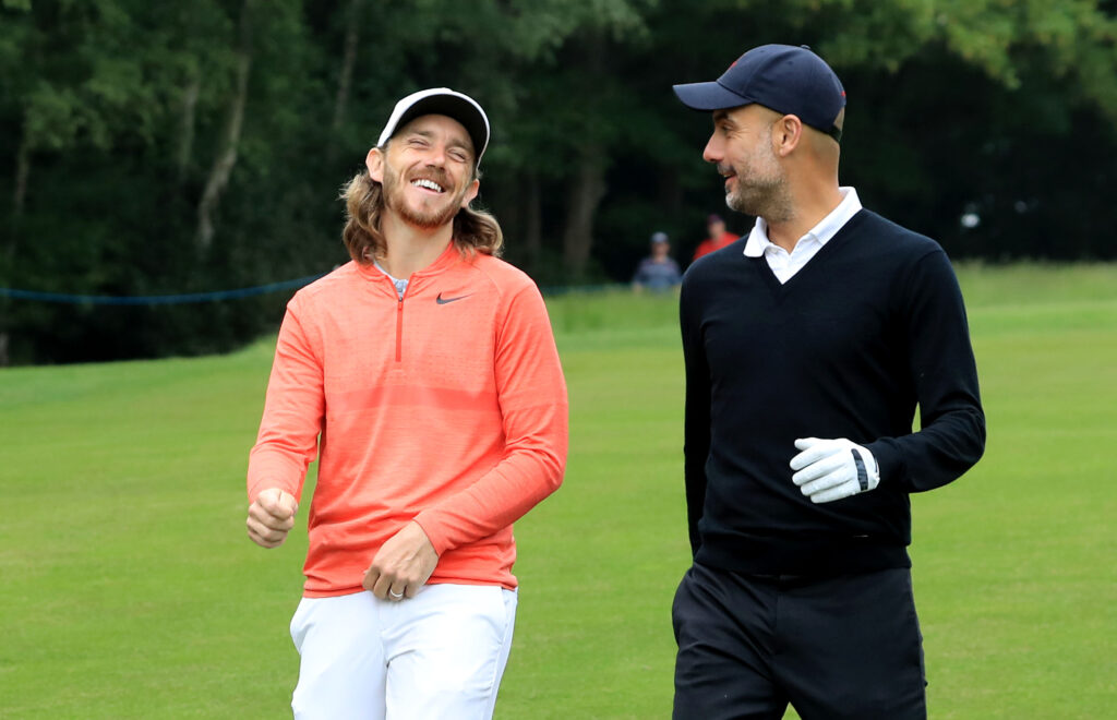 Pep Guardiola of Spain the Manchester City Football Club manager with his professional playing partner Tommy Fleetwood of England during the pro-am for the 2018 BMW PGA Championship