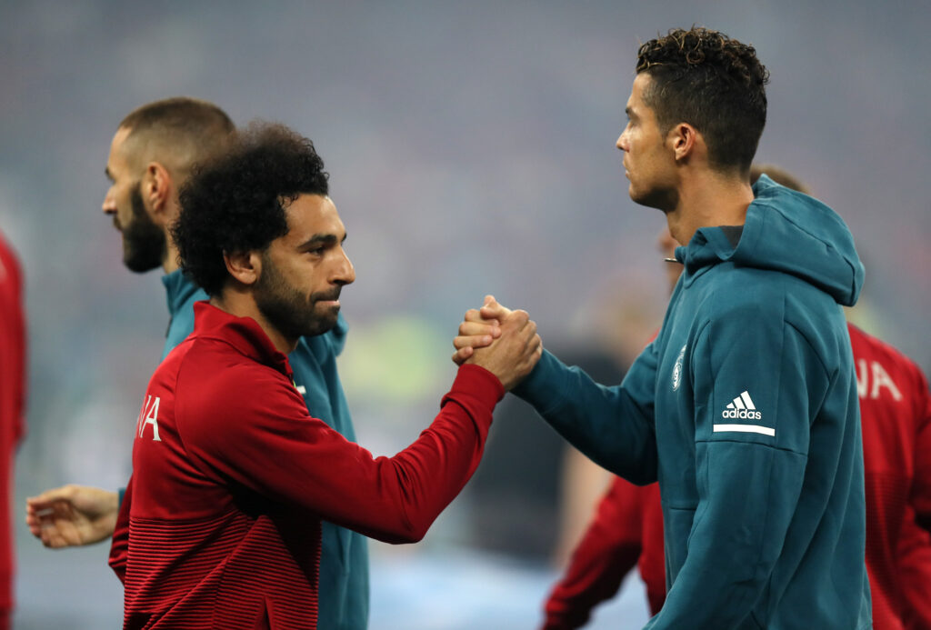 Mohamed Salah of Liverpool greets Cristiano Ronaldo of Real Madrid before the UEFA Champions League final between Real Madrid and Liverpool.