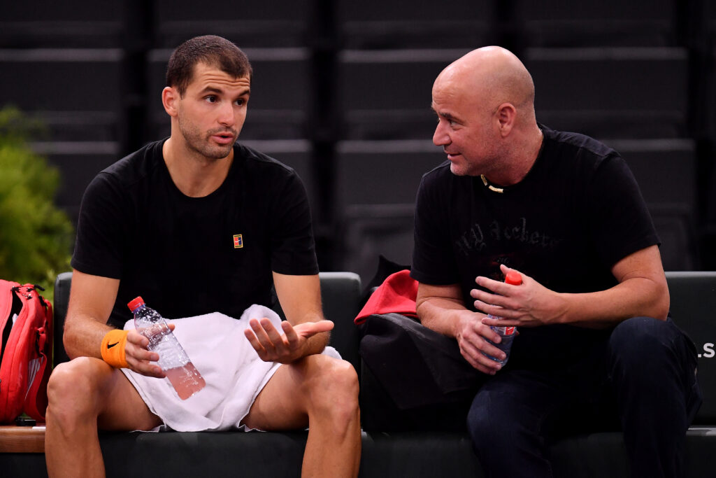 Grigor Dimitrov and Andre Agassi in conversation at the 2018 Paris Masters