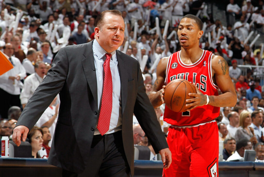 Derrick Rose #1 walks off the court as Tom Thibodeau of the Chicago Bulls reacts after calling a timeout against the Atlanta Hawks in Game Six of the Eastern Conference Semifinals in the 2011 NBA Playoffs at Phillips Arena.