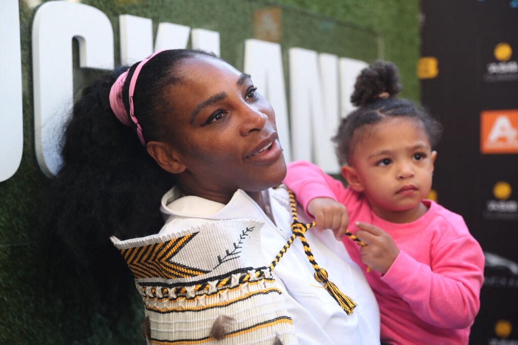 Serena Williams of the US with her daughter Alexis Olympia give an interview after her win against Jessica Pegula of the US during their women's singles final match during the Auckland Classic tennis tournament.