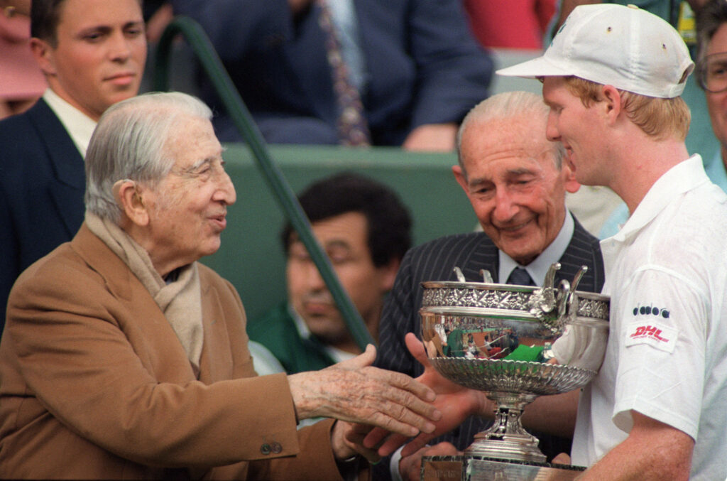 Jim Courier receives the French Open trophy in 1992
