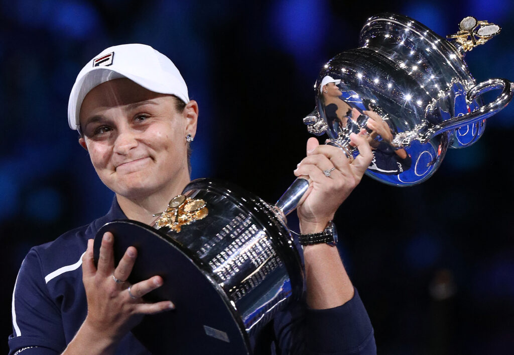Australia's Ashleigh Barty poses with the trophy after victory in her womens singles final match against Danielle Collins of the US on day thirteen of the Australian Open tennis tournament in Melbourne on January 29, 2022.
