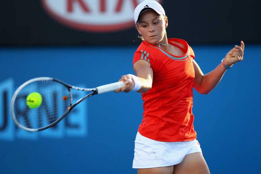 Ashleigh Barty of Australia plays a forehand in her first round match against Anna Tatishvili of Georgia during day one of the 2012 Australian Open at Melbourne Park on January 16, 2012 in Melbourne, Australia.