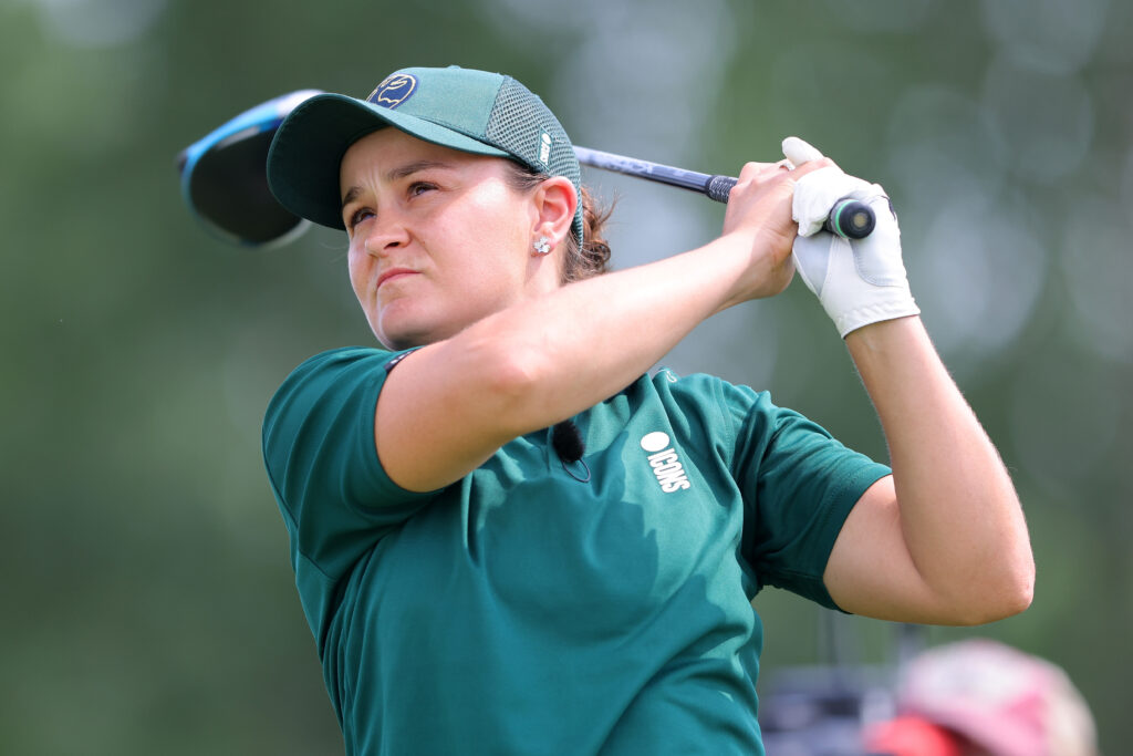 Ash Barty plays her tee shot during her Singles Match on Day Two of the ICON Series at Liberty National Golf Club on July 01, 2022