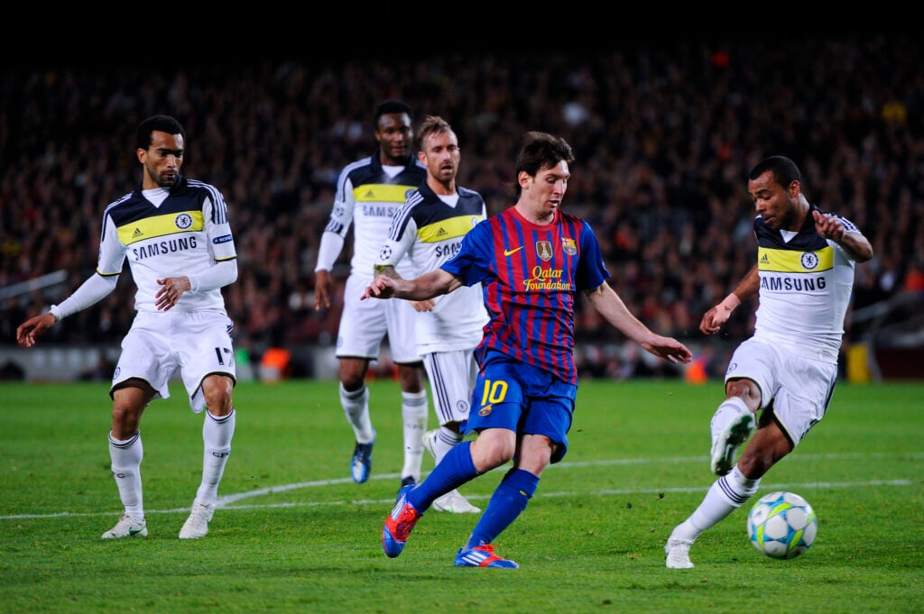 Lionel Messi of FC Barcelona (C) duels for the ball with Ashley Cole of Chelsea (R) during the UEFA Champions League Semi Final, second leg match between FC Barcelona and Chelsea FC.