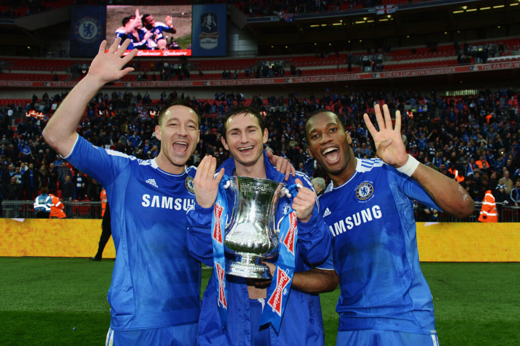 Frank Lampard, John Terry and Didier Drogba of Chelsea celebrate with the trophy after the FA Cup Final with Budweiser between Liverpool and Chelsea at Wembley Stadium.