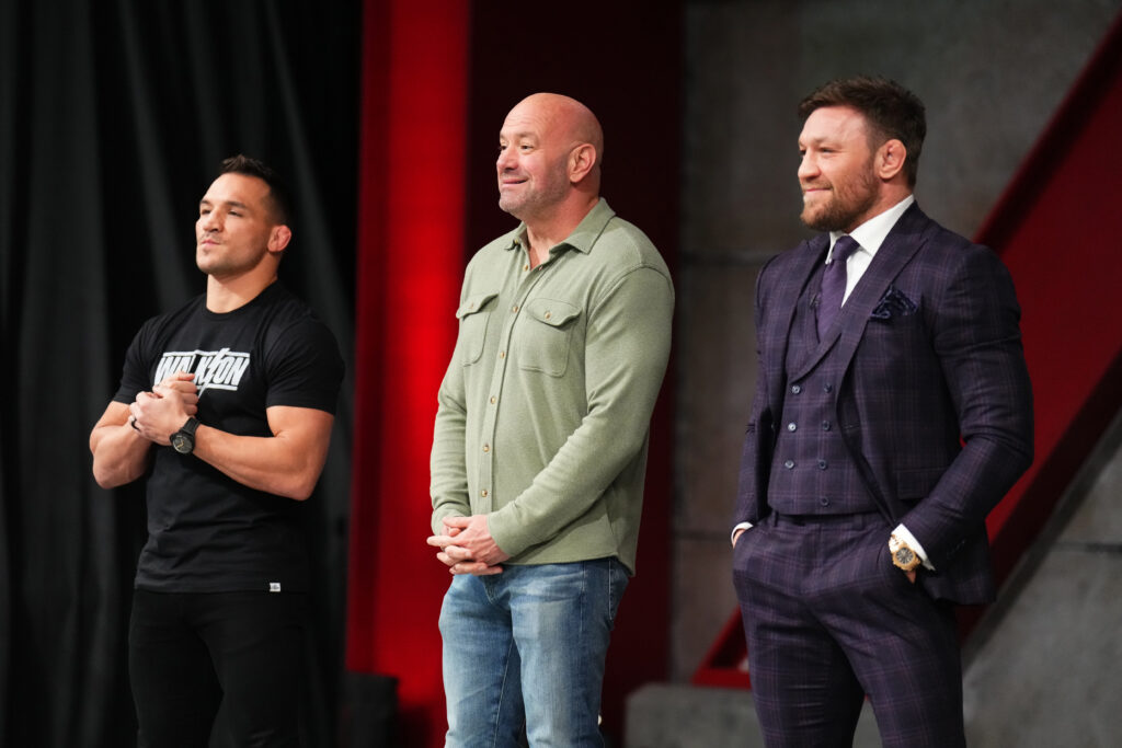 UFC President Dana White (C) speaks to the cast as coaches Michael Chandler (L) and Conor McGregor (R) look on during the filming of The Ultimate Fighter at UFC APEX on February 16, 2023.