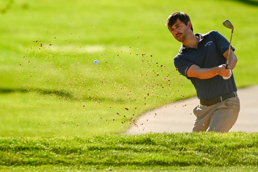 Ollie Schniederjans chips on the third hole during the second round of the Utah Championship presented by Zions Bank at Oakridge Country Club