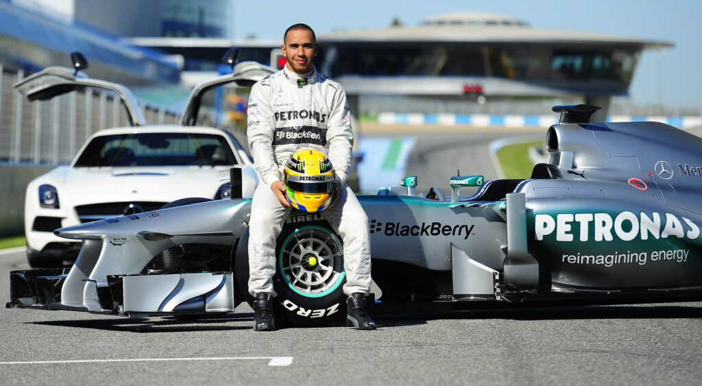 Lewis Hamilton poses for a photo at Mercedes' 2013 team launch after joining from McLaren