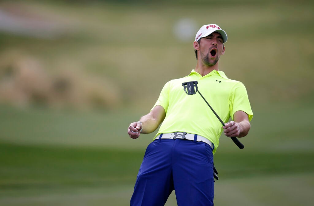 Olympic gold medalist Michael Phelps reacts to a missed putt during the first round of ARIA Resort & Casino's 12th annual Michael Jordan Celebrity Invitational golf tournament at Shadow Creek on April 4, 2013