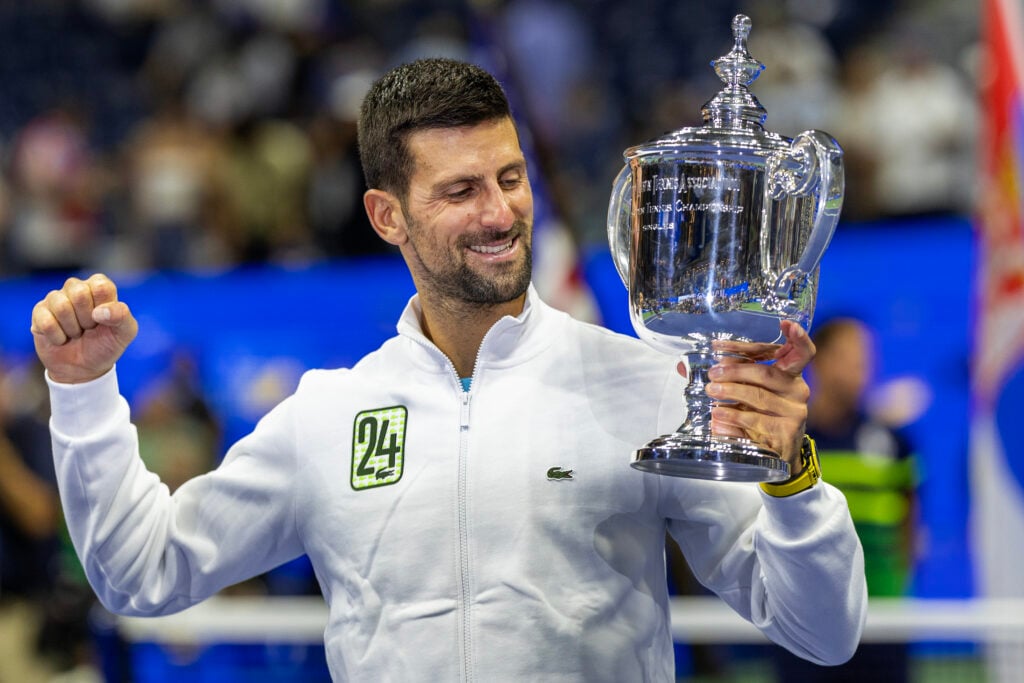 Novak Djokovic celebrates with the title after winning the 2023 US Open