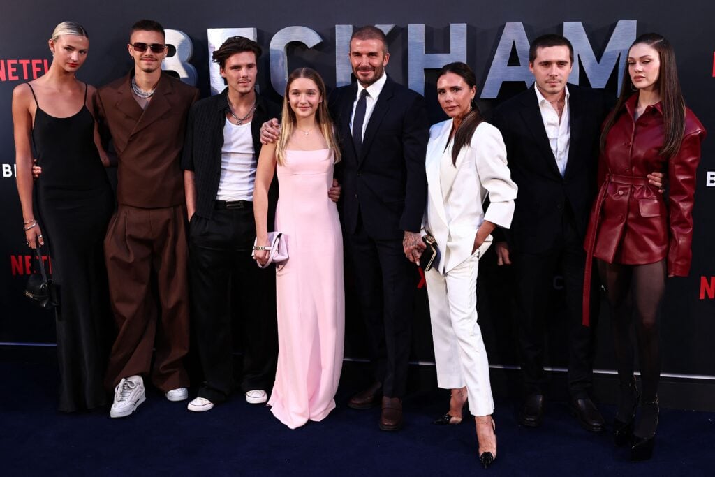 England footballer David Beckham (5L) and his wife Victoria Beckham (3R) pose on the red carpet with their children, and partners, (from L) Mia Regan, Romeo Beckham, Cruz Beckham, Harper Beckham, Brooklyn Beckham and Nicola Peltz Beckham.