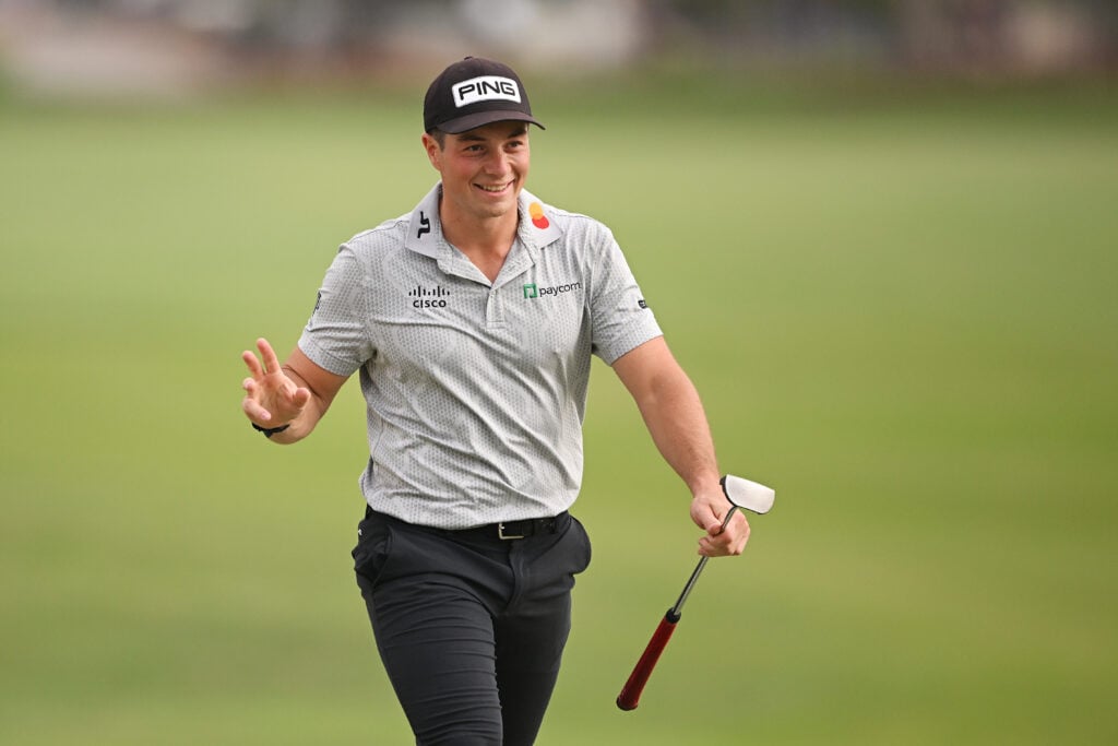 Viktor Hovland of Norway smiles on the 18th green during Day One of the DP World Tour Championship