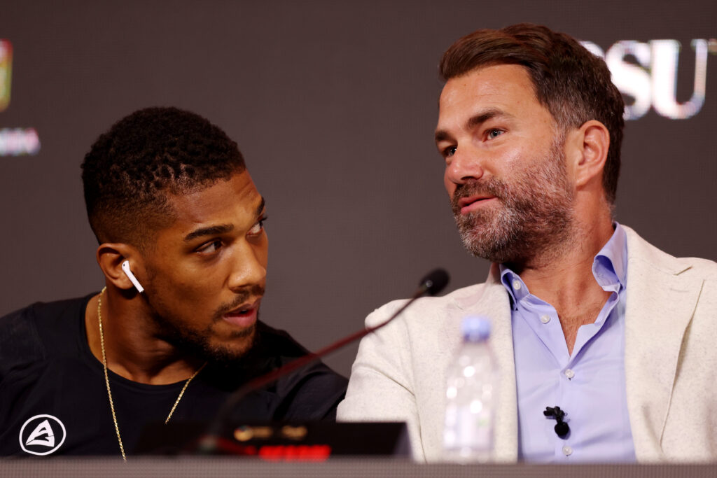 Anthony Joshua speaks with Promotor Eddie Hearn, Chairman of Matchroom Sport, during the press conference ahead of the Heavyweight fight between Anthony Joshua and Otto Wallin during the Day of Reckoning card