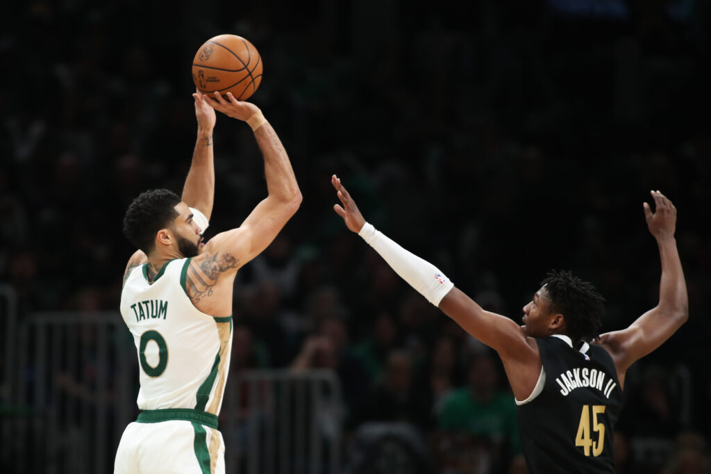 Jayson Tatum #0 of the Boston Celtics shoots against Gregory Jackson #45 of the Memphis Grizzlies during the second half at TD Garden.