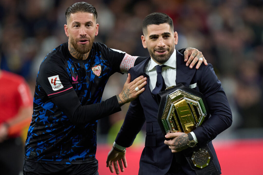 Ilia Topuria, UFC Featherweight Champion, interacts with Sergio Ramos of Sevilla FC on the pitch prior to the LaLiga EA Sports match between Real Madrid CF and Sevilla FC.