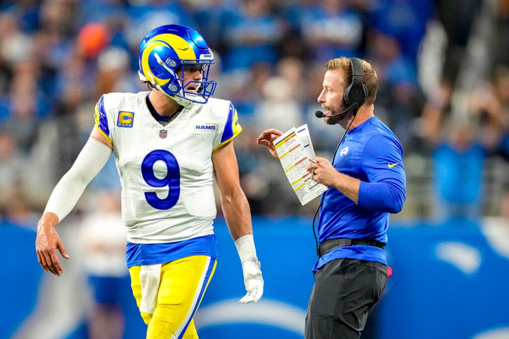 Head coach Sean McVay of the Los Angeles Rams speaks with Matthew Stafford #9 during their game against the Detroit Lions at Ford Field.