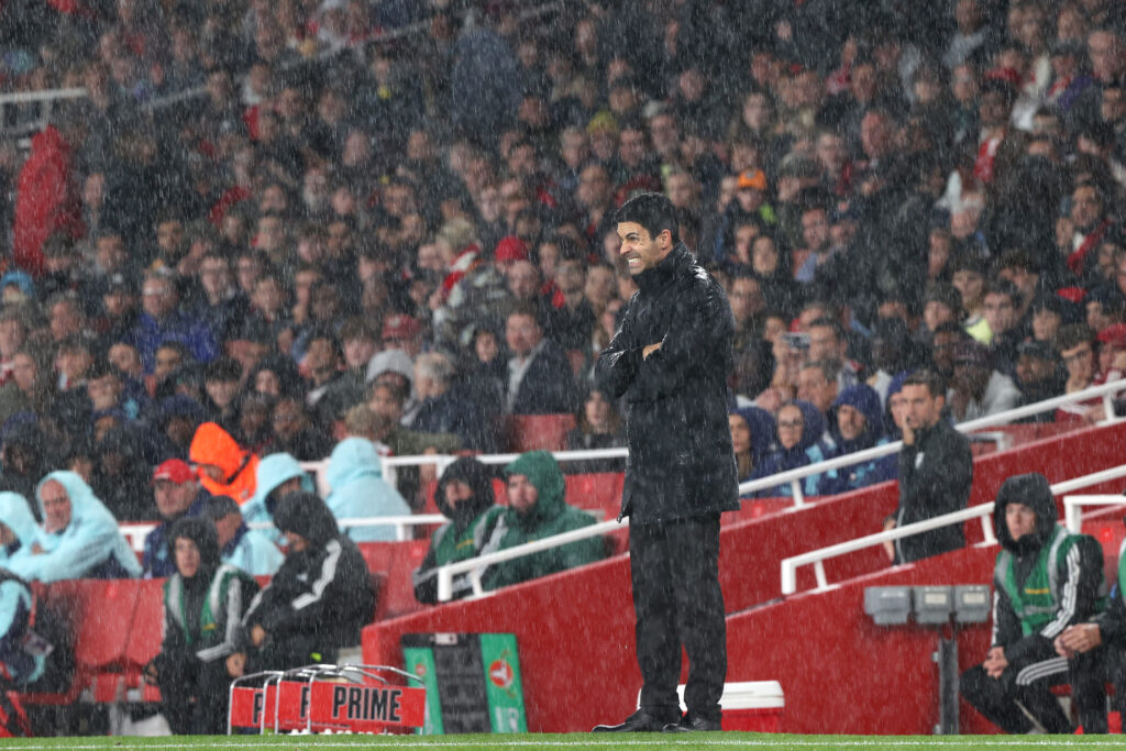 Arsenal manager Mikel Arteta stands in the heavy rain during the Carabao Cup Third Round match between Arsenal and Bolton Wanderers at Emirates Stadium on September 25, 2024.