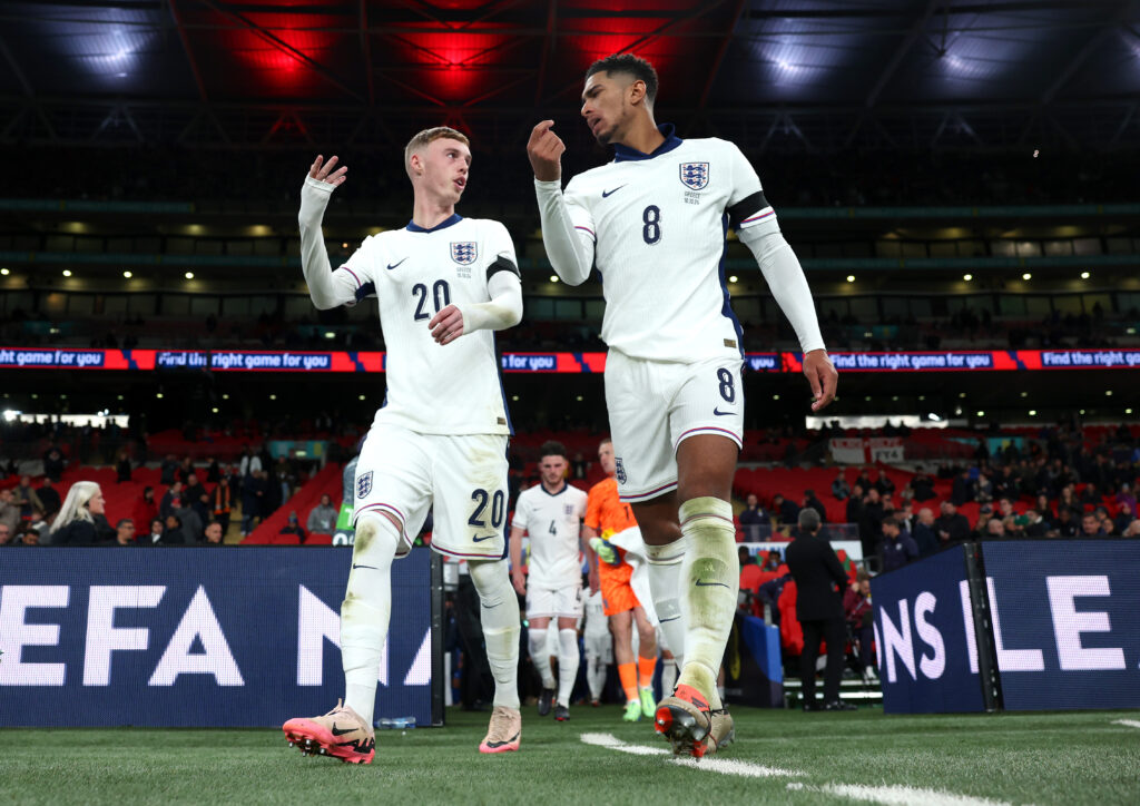 Cole Palmer and Jude Bellingham of England talk as they take to the pitch ahead of the second half during the UEFA Nations League.