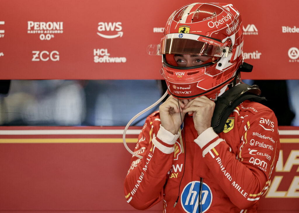 Ferrari driver Charles Leclerc gets ready in the garage before the 2024 F1 United States Grand Prix
