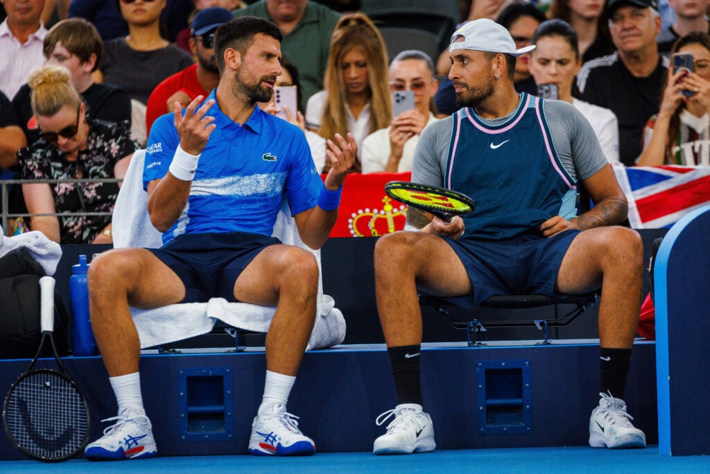 Novak Djokovic of Serbia (L) and Nick Kyrgios of Australia react during their men's doubles match against Michael Venus of New Zealand and Nikola Mektic of Croatia at the Brisbane International tennis tournament.