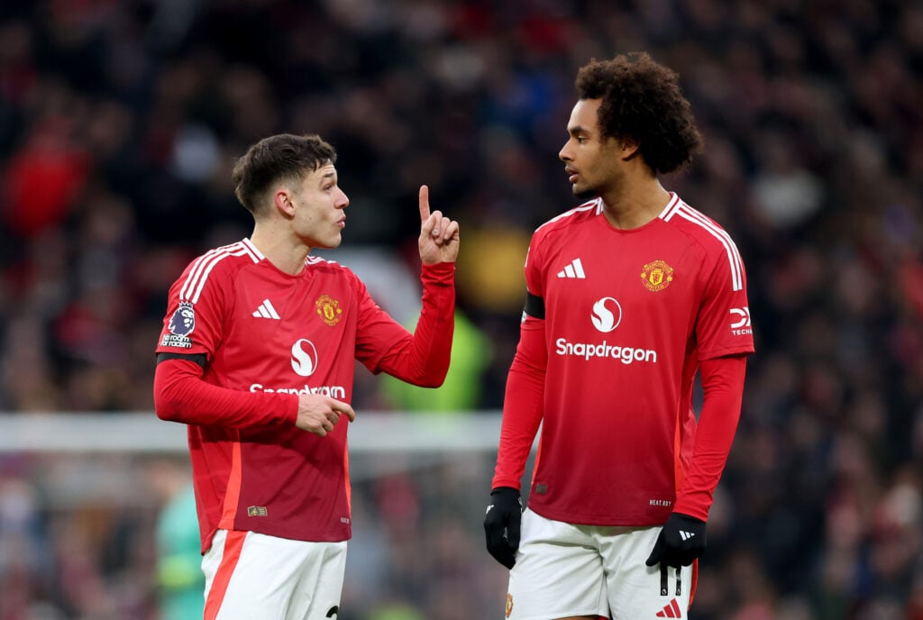 Manuel Ugarte of Manchester United and Joshua Zirkzee of Manchester United interact during the Premier League match between Manchester United FC and Crystal Palace FC.