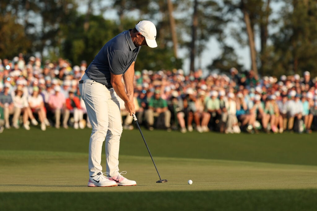 Rory McIlroy of Northern Ireland putts for birdie to win the 2025 Masters Tournament