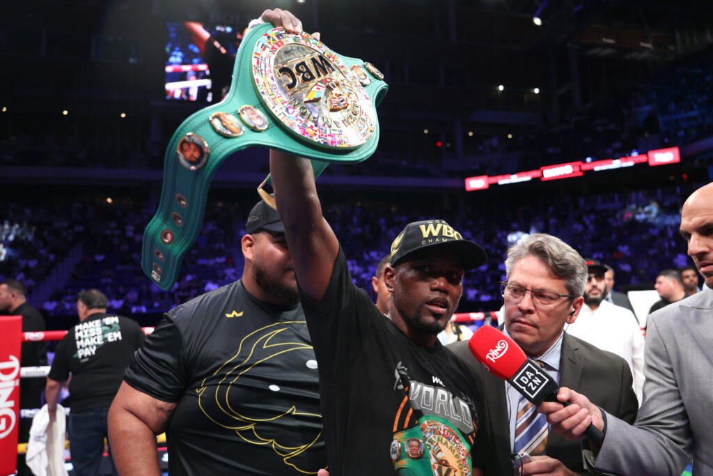 Subriel Matias raises his super lightweight title belt after defeating Alberto Puello at Louis Armstrong Stadium.