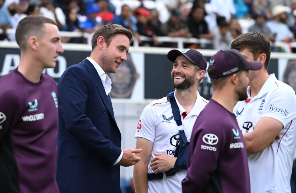 England batsman Chris Woakes with his arm in a sling speaks with former player Stuart Broad after day five of the Fifth Test Match between England and India at The Kia Oval on August 04, 2025.