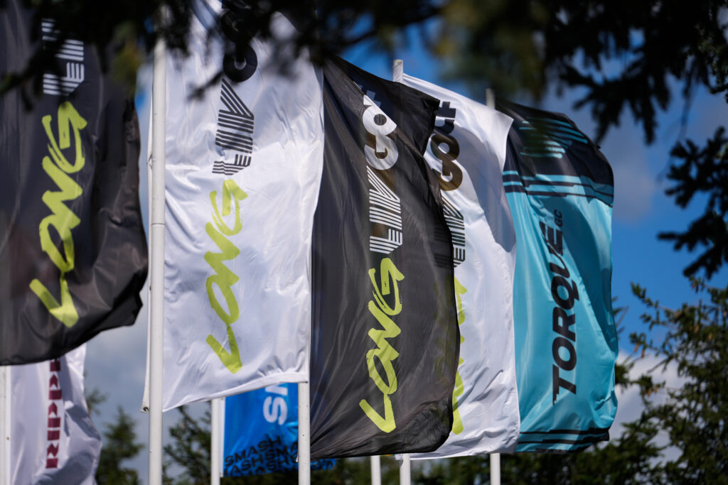 Flags blowing in the wind near the practice putting green during day three of the LIV Golf Team Championship.