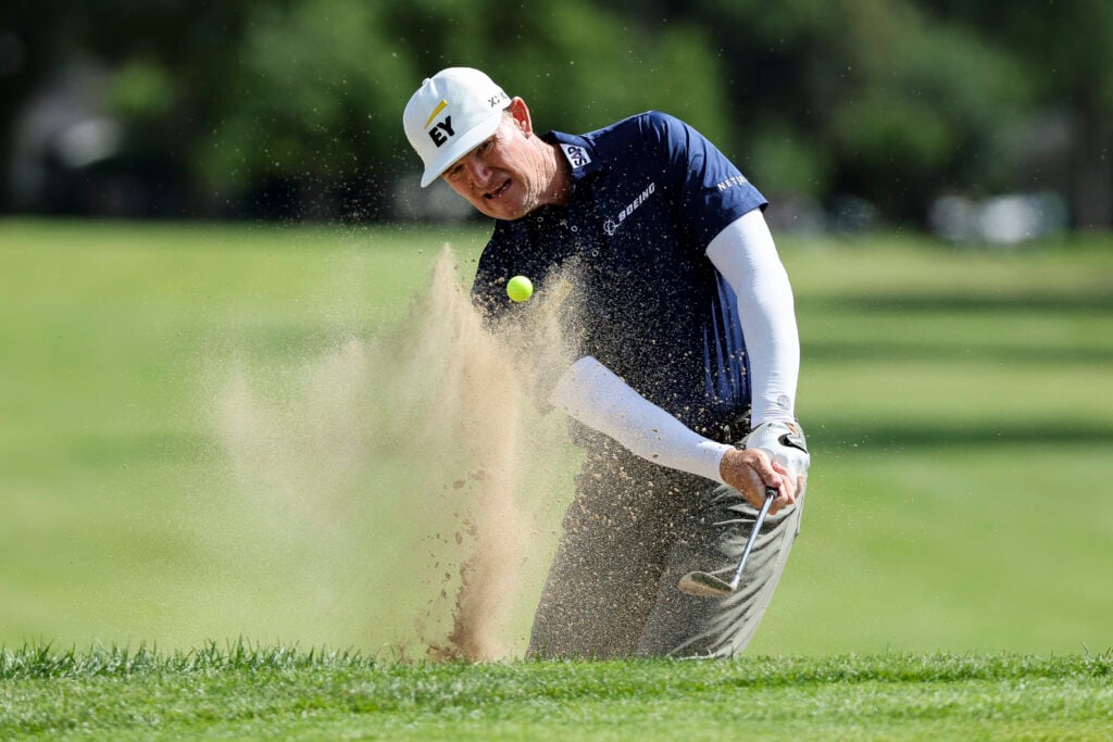 Ernie Els of South Africa hits out of a greenside bunker on the 15th hole during the third round of The Ally Challenge 2025 at Warwick Hills Golf And Country Club