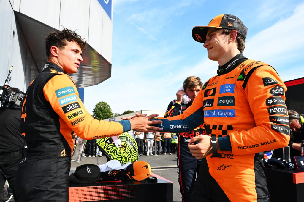 McLaren's Lando Norris and Oscar Piastri shaking hands after the 2025 Italian Grand Prix.