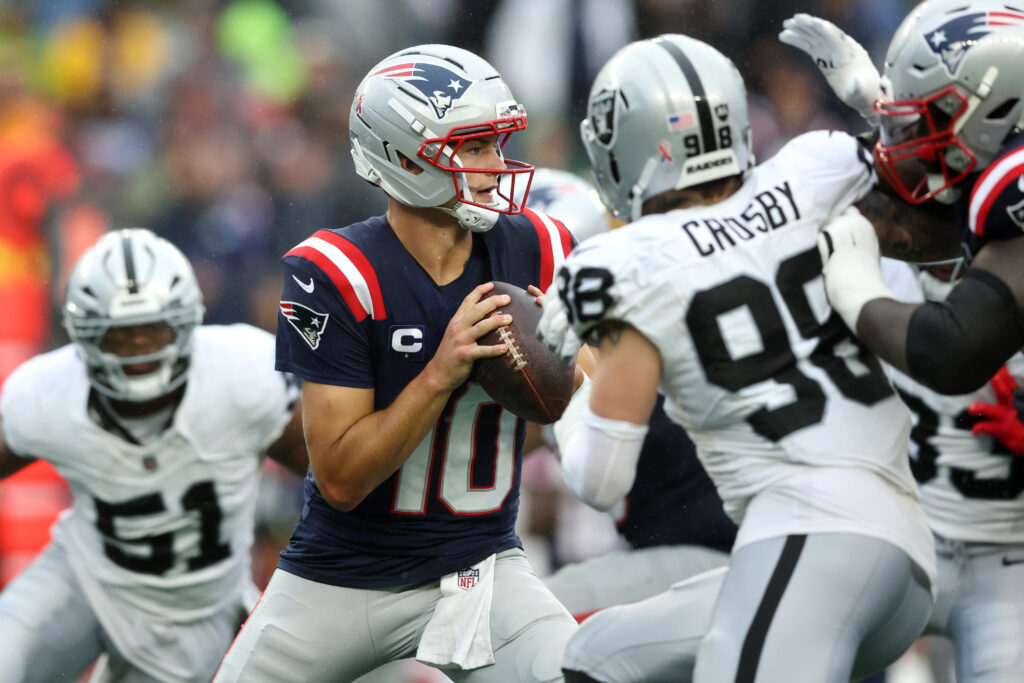 Drake Maye #10 of the New England Patriots looks to pass during the NFL 2025 game between Las Vegas Raiders and New England Patriots at Gillette Stadium.