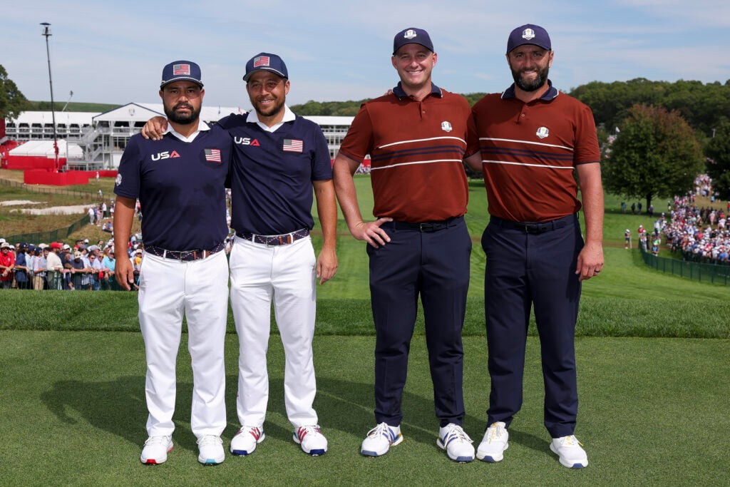 J.J. Spaun of Team United States, Xander Schauffele of Team United States, Sepp Straka of Team Europe and Jon Rahm of Team Europe pose for a photo at the first hole tee box during the Saturday afternoon four-balls matches of the 2025 Ryder Cup