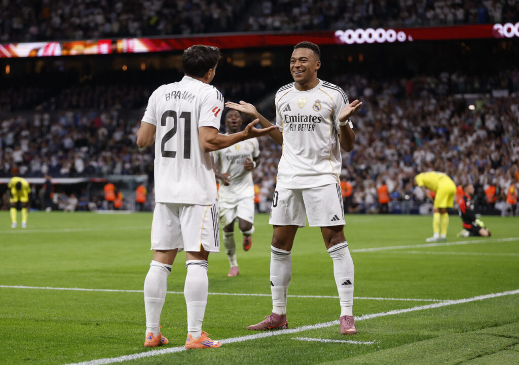 Kylian Mbappe player of Real Madrid celebrates with his teammate Brahim Diaz after scoring a goal during the LaLiga EA Sports match between Real Madrid CF and Villarreal CF at Estadio Santiago Bernabeu.