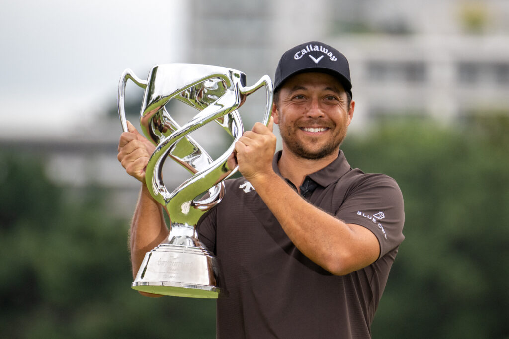 USA's Xander Schauffele celebrates with the trophy after winning the PGA Baycurrent Classic golf tournament in Yokohama