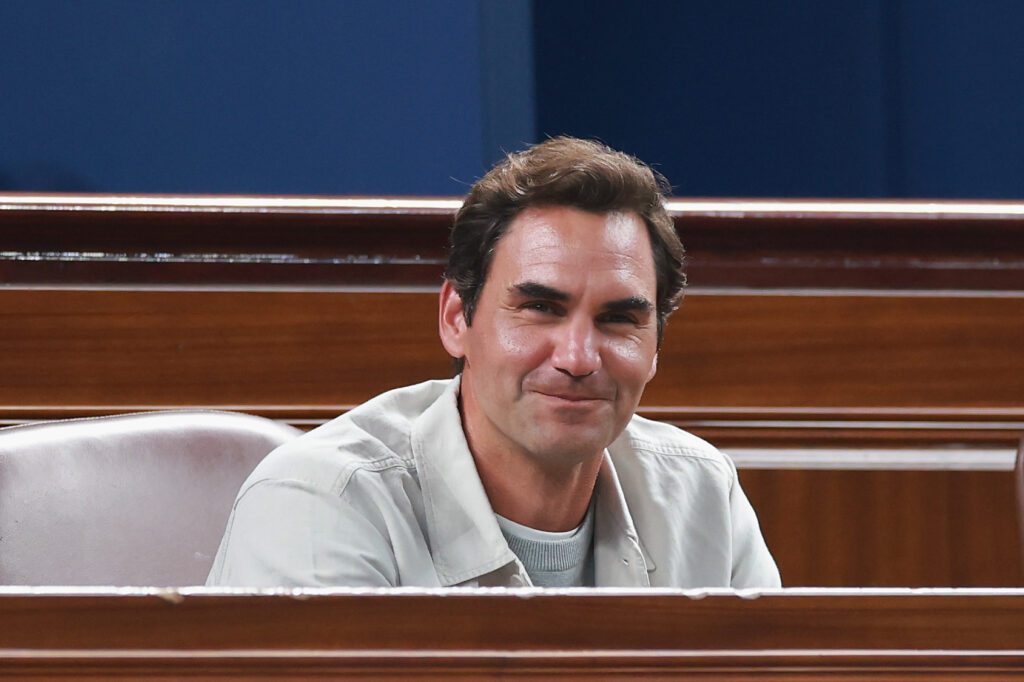 Roger Federer smiles when attending the men's singles final at the 2025 Shanghai Masters final.