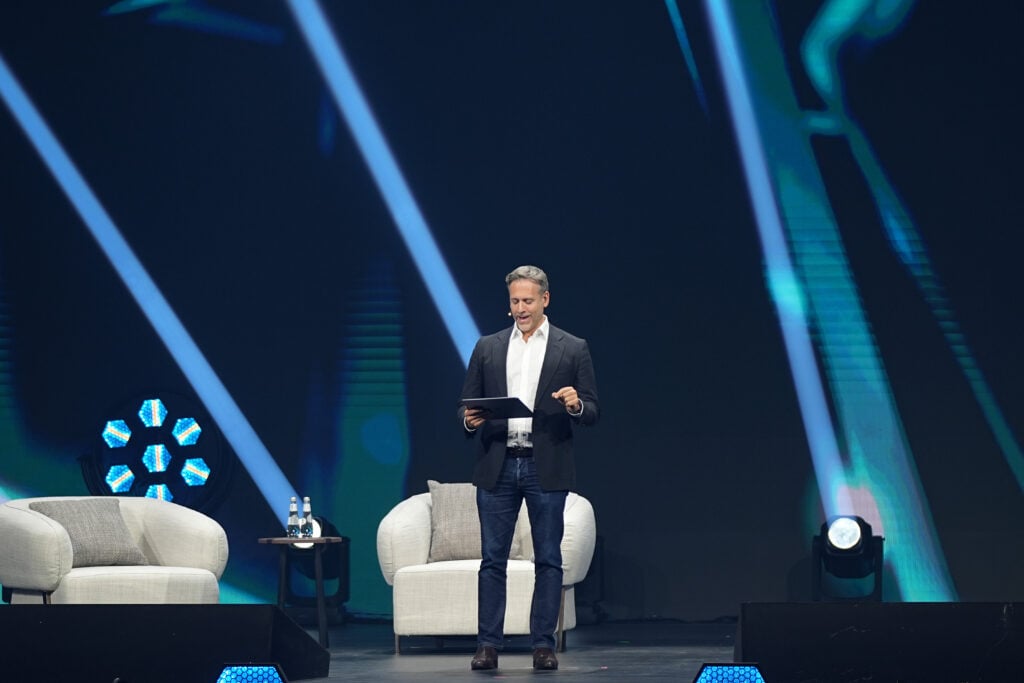 Max Kellerman speaks on stage during the 'UNCONVENTIONAL PIONEER: Redefining Sports Entertainment' panel at the 2025 Joy Forum at SEF Arena on October 16, 2025.