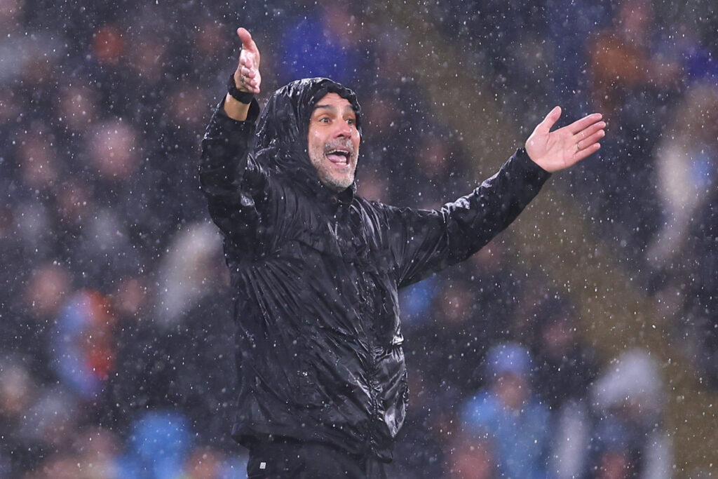 Pep Guardiola Manager / Head Coach of Manchester City in the rain during the Premier League match between Manchester City and Liverpool at Etihad Stadium.
