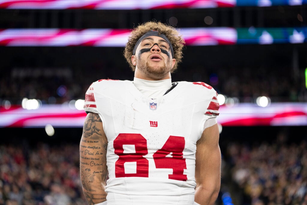 Theo Johnson #84 of the New York Giants looks on during the national anthem prior to an NFL football game against the New England Patriots at Gillette Stadium on December 01, 2025.