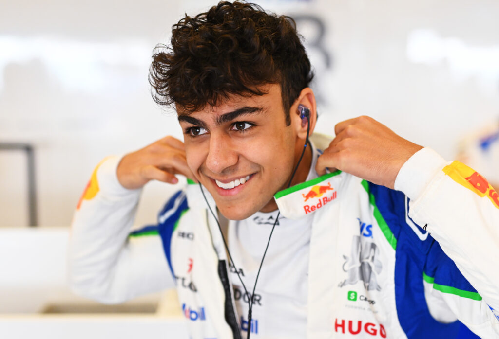 Arvid Lindbald smiles as he puts on his Racing Bulls race suit ahead of post season testing at the 2025 Abu Dhabi Grand Prix