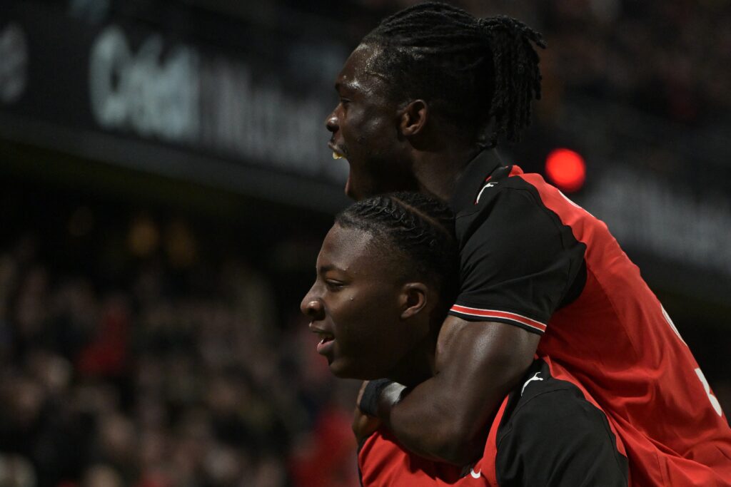 Rennes' French forward #39 Mohamed Kader Meite (bottom) celebrates his team's third goal with Rennes' Ghanaian defender #36 Alidu Seidu during the French L1 football match between Stade Rennais FC and Stade Brestois 29 at the Roazhon Park stadium.
