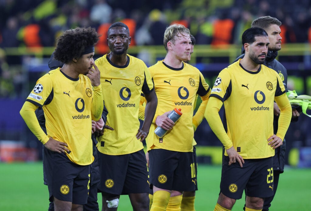 Karim Adeyemi of Borussia Dortmund and teammates Serhou Guirassy, Julian Brandt and Emre Can look dejected after the UEFA Champions League 2025/26 League Phase MD6 match between Borussia Dortmund and FK Bodo/Glimt at BVB Stadion Dortmund.
