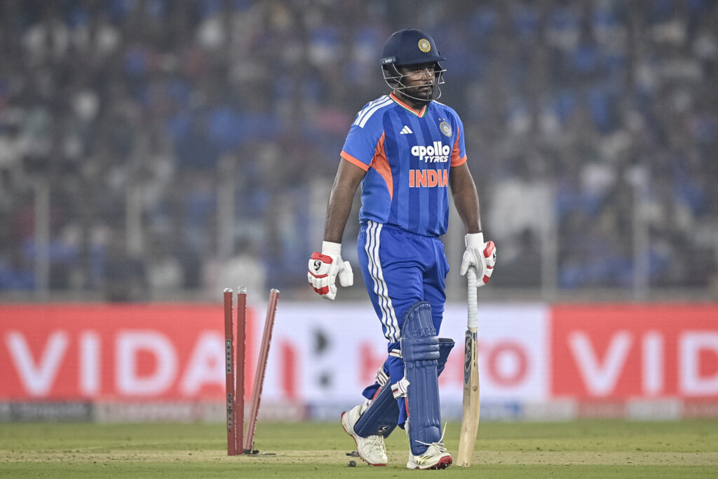 India's Sanju Samson walks back to the pavilion after his dismissal during the fifth Twenty20 international cricket match between India and South Africa at the Narendra Modi Stadium.