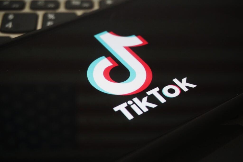 In this photo illustration, the logo of TikTok is displayed on a smartphone screen.