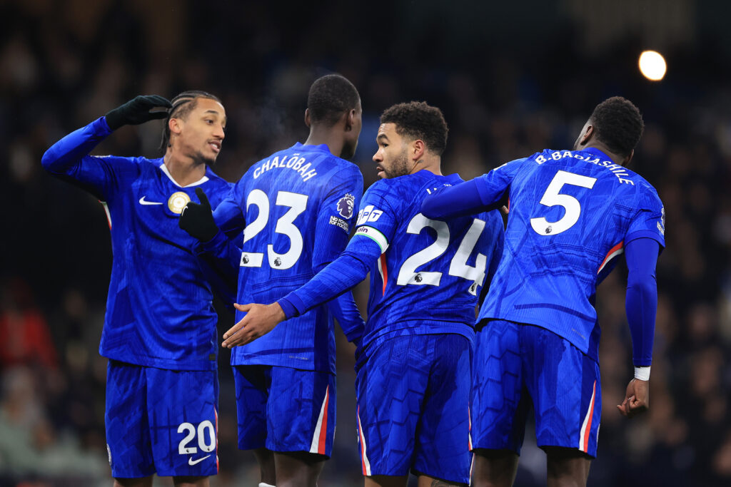 Reece James of Chelsea (2R) organises a defensive wall including teammates Joao Pedro of Chelsea (L), Trevoh Chalobah of Chelsea (2L) and Benoit Badiashile of Chelsea (R) during the Premier League match between Manchester City and Chelsea at Etihad Stadium.