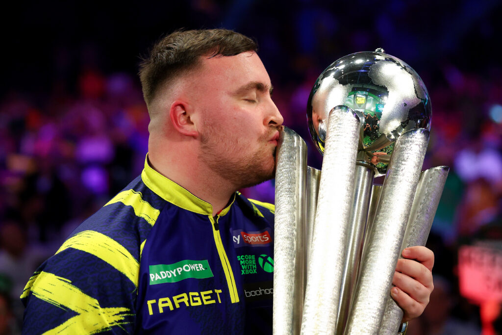 Luke Littler of England kisses the Sid Waddell trophy after defeating Gian van Veen of the Netherlands (not pictured) during the 2025/26 Paddy Power World Darts Championship Final match between Luke Littler and Gian van Veen at Alexandra Palace on January 03, 2026 in London, England.